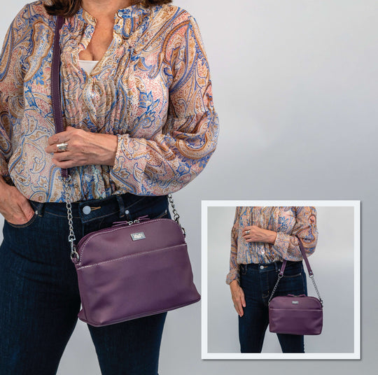 Rebecca - Outlet: Stylish woman holding a purple crossbody bag with chic chain detailing.