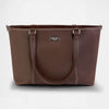 The Jet - Travel Tote Bag - Outlet - Stylish brown tote bag with spacious design and sturdy handles.